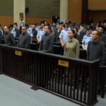 China delivers death penalty to 11 members of mafia family