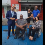 Phillip Alexander makes donation to T&T Chapter of Disabled Peoples' International