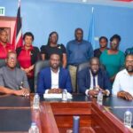 Division of Community Development, NUGFW sign Permanent List Agreement