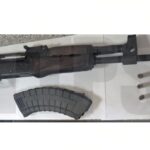 Woman held as police seize high-powered rifle